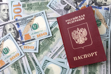 Passport and banknotes for a hundred dollars. .Russian international passport. Travel concept