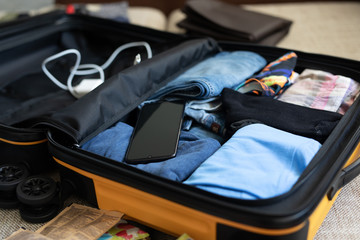 men's clothing packed in a suitcase