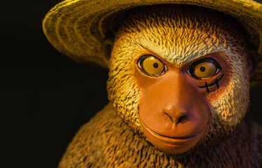 monkey figure toy head macro closeup view