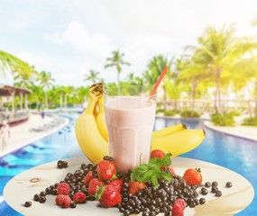 Healthy Fruit Smoothie in glass on wooden table Background