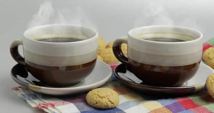 Cookie and two cups of coffee. Kruidnoten, pepernoten, strooigoed