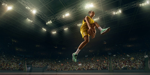 Fototapeta na wymiar Female basketball player makes slam dunk. Basketball player on big professional arena during the game
