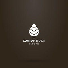 white logo on a black background. simple flat art vector negative space logo of leaf of tree