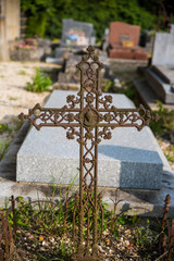 Ancient cross on tombs in a cemetery