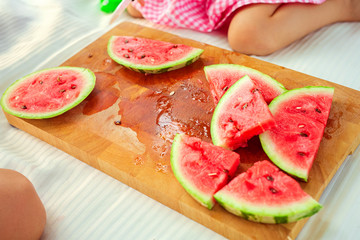 Slices of watermelons on cutting board outdoor