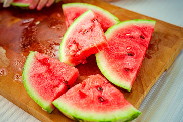 Slices of watermelons on cutting board outdoor