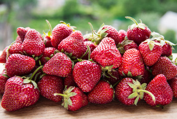 group of strawberries on rustic background