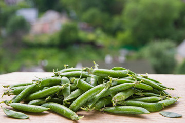 green peas on rustic background