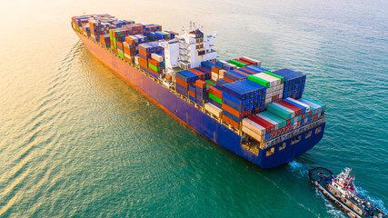 Container ship sailing through the ocean, Business logistics and transportation of International...