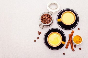 Obraz na płótnie Canvas Golden turmeric cinnamon coffee latte