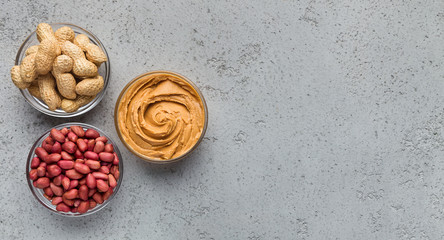 Bowls with peanuts and peanut butter