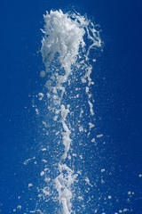 champagne splashes on blue background
