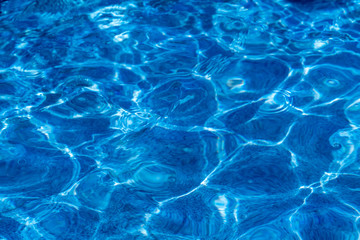 the texture of pure blue water in the pool