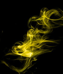 Yellow smoke on black background