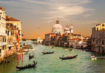 Fototapeta na wymiar Venice, the Grand canal, the Cathedral of Santa Maria della Salute and gondolas with tourists, top view
