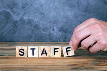 Staff - word from wooden letters on wooden table