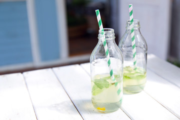 Two bottles with lemonade.