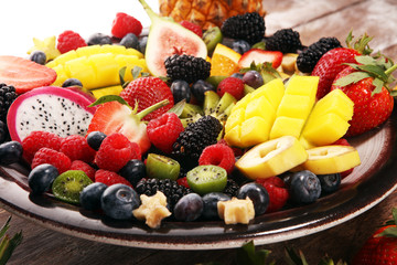salad with fresh fruits and berries. healthy spring fruit salad  with strawberries
