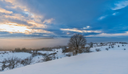Obraz na płótnie Canvas Winter mountain colorful sky and sunset