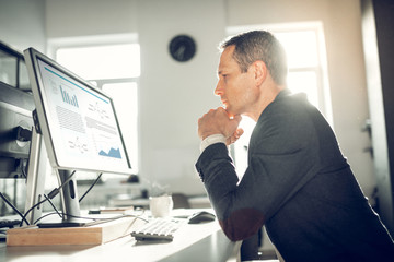 CEO feeling thoughtful before sending e-mail to partner