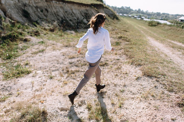 Beautiful and happy woman girl have fun and relax in summer. Portrait of a beautiful girl on the Planer near the cliff. Freedom for a walk