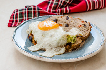 Fried Egg with Avocado on Toast Bread for Breakfast