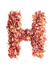 Letter H made of rose petals, isolated on white background. Food typography, english alphabet. Design element.