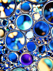 blue oil bubbles on liquid abstract texture for background