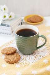 A study break: a cup of tea and a plate of cookies.