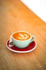 Latte coffee on wood table