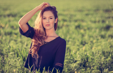 Woman on a green wheat field