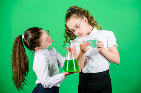 Lovely day in the laboratory. biology education. school kid scientist study science. children at chemistry lab. back to school. little smart girls with testing flask. Researches in science laboratory