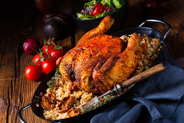 Grilled spicy chicken with barley groats and mushrooms