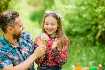 It is my life. daughter and father love dandelion flower. family summer farm. ecology. Happy family...