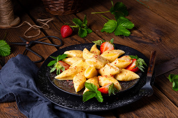 Kopytka - polish potato dumpling with strawberries
