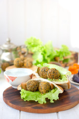 Falafel with lettuce and vegetables in pita bread.