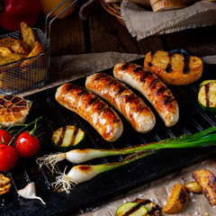 Delicious  grilled sausage with various grilled vegetables