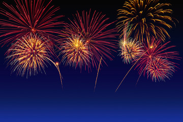 Naklejka premium Colorful fireworks celebration and the twilight sky background.