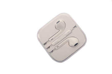 White headphones with headset lie on white isolated background.