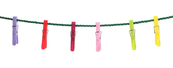 Colorful clothespins on a rope isolated on white background