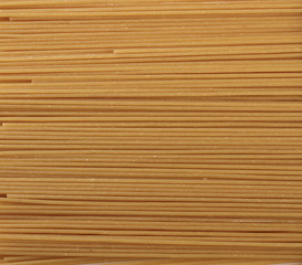 Integral spaghetti pasta background and texture, top view