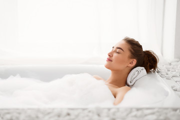 Relax Concept. Woman Enjoying Hot Bath With Foam