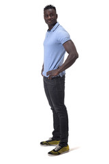 Fototapeta premium full portrait of an african man with his hands on waist