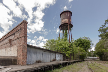 Giant water tower looms of abandoned factory