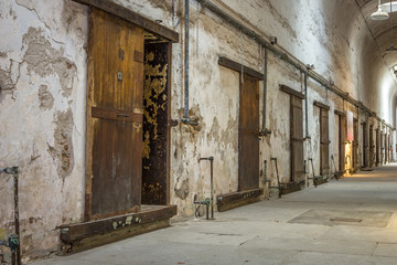 Fototapeta na wymiar Old solitary cells in a long abandoned prison