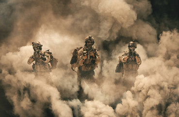 Military soldier between smoke and dust in battlefield - obrazy, fototapety, plakaty