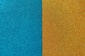 Bright festive brilliant background, consisting of two halves, blue and gold. Horizontal. Copy space for text. Celebration, holidays, travel concept.