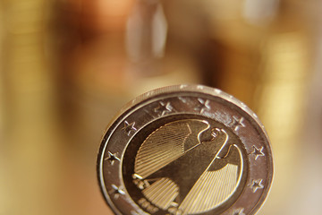 bimetallic coin 2 euro obverse of the Germanic from copper-nickel alloy with stars, close-up, macro photography