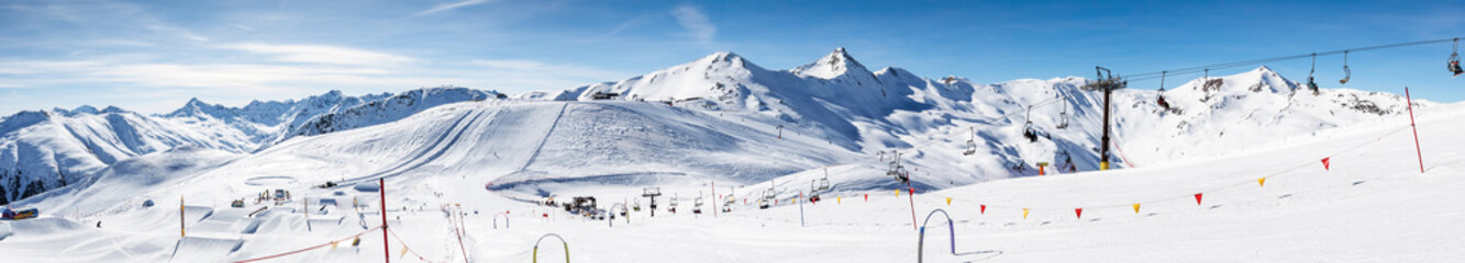 Fototapeta na wymiar Skiers skiing in Carosello 3000 ski resort, Livigno, Italy, Europe