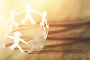 Circle of paper people on paper background